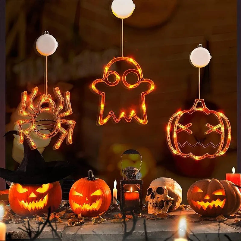 Seven Halloween LED window lights with spider, pumpkin, and ghost designs featuring suction cups for mounting