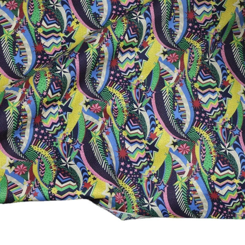 Blue cotton fabric with plant and flower digital print showing 145cm width measurement