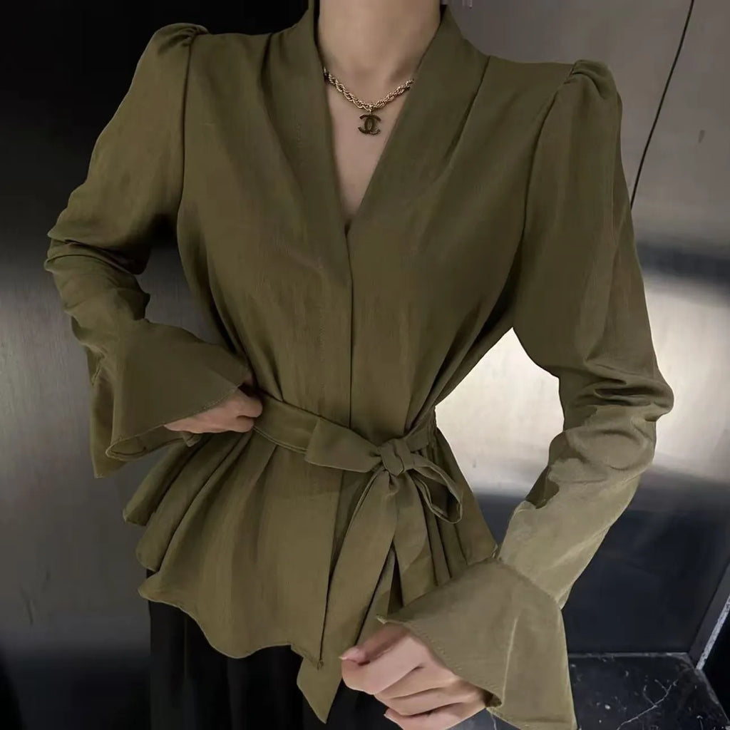 Women's black French-style shirt with irregular collar and long tied bell sleeves.