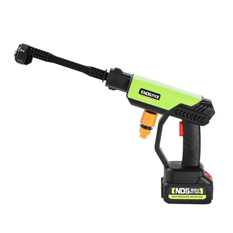 Green wireless high-pressure water gun with multiple nozzle attachments on a patio.