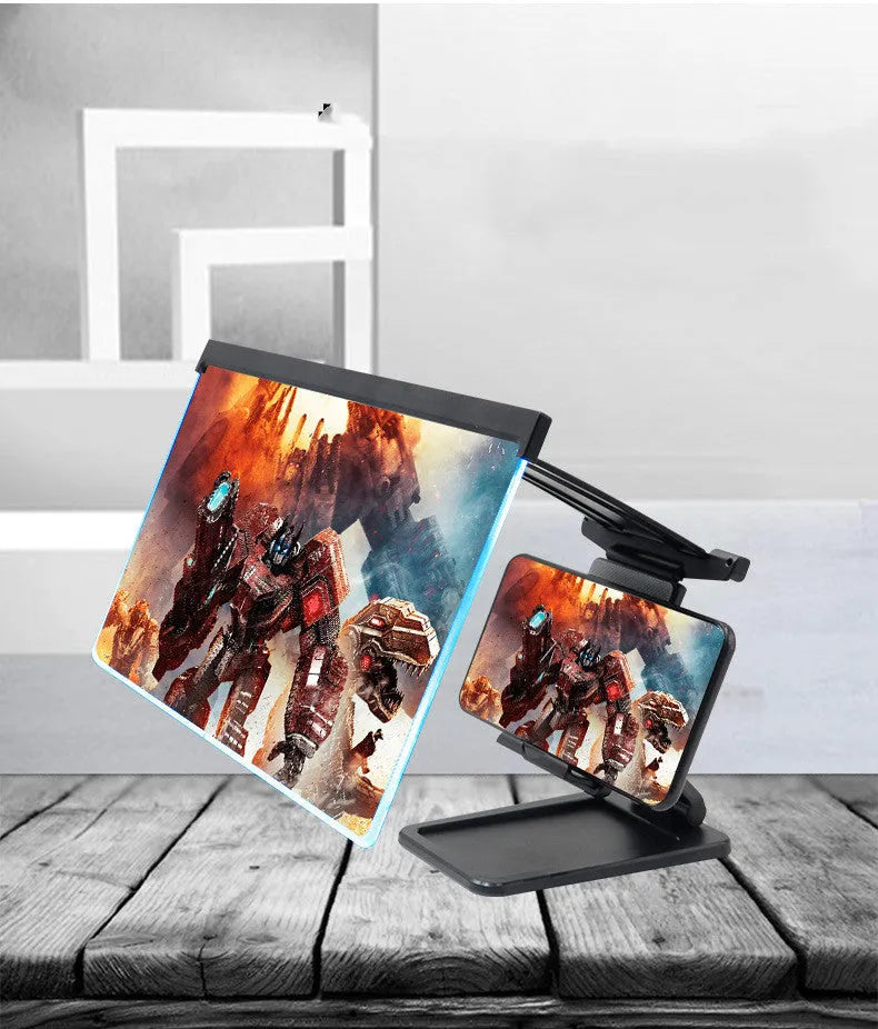 Black folding mobile phone screen amplifier with detachable holder next to an iPhone.