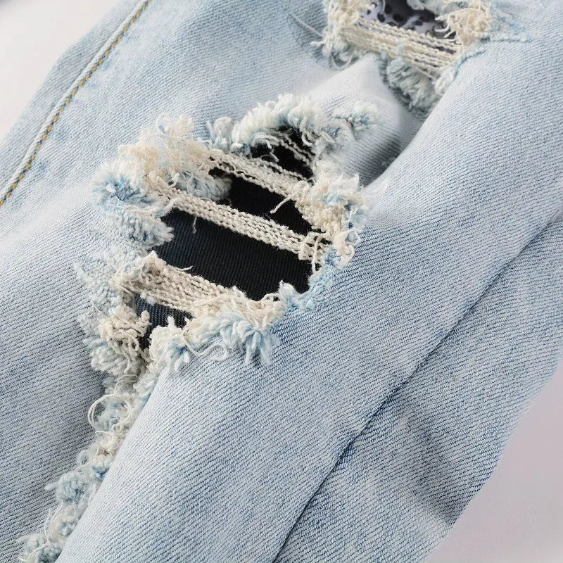 Light blue elastic tight fit jeans for men with patchwork and cat whisker finish