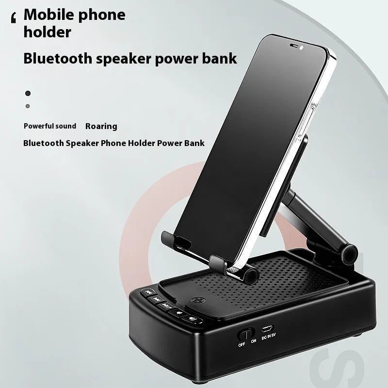 Multifunctional plastic tablet and phone holder with audio in black on a desk