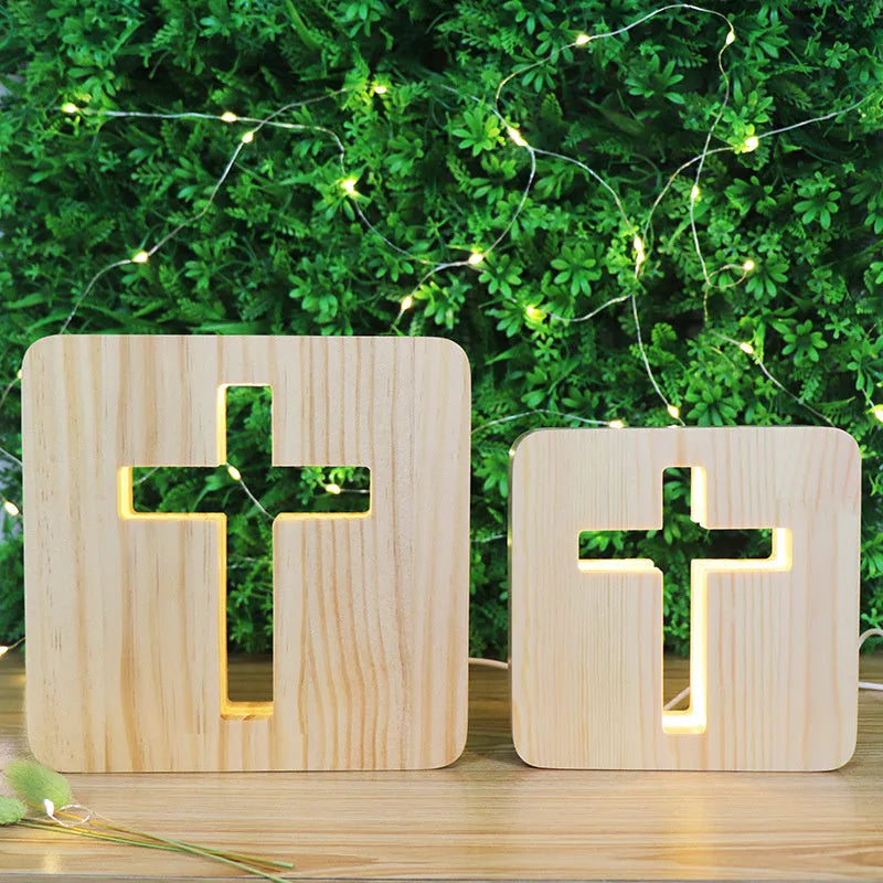 Solid wood hollow LED night lamp warm white with USB cable on wooden surface