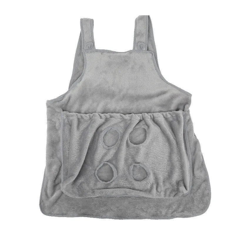 Plush pet carrier apron for small cats and dogs with adjustable strap and head opening.