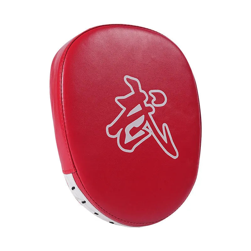 Curved red and black PU boxing punch mitts held vertically for martial arts training.