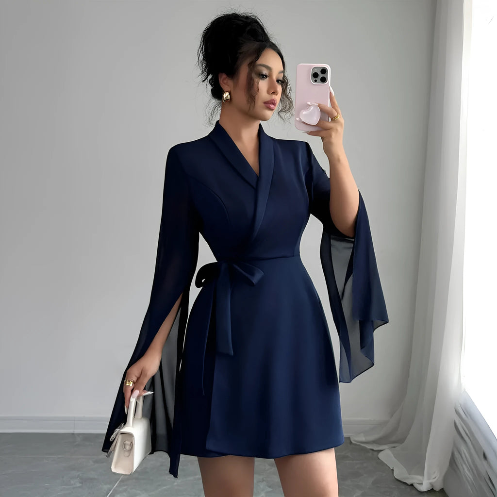 Navy blue A-line long sleeve tie dress with bell sleeves and short flared skirt, sizes S to XL