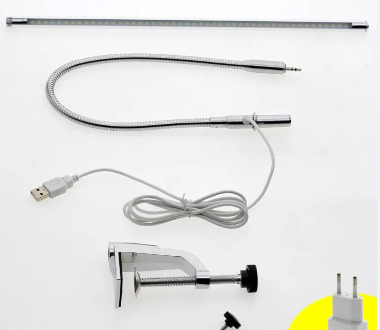 Silver aluminium USB-powered clip-on LED table lamp with a long arm extended, for nail art and detailed tasks.