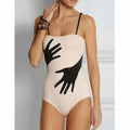 Women's one-piece bikini swimsuit with a gauze skirt attached, shown in available colours.