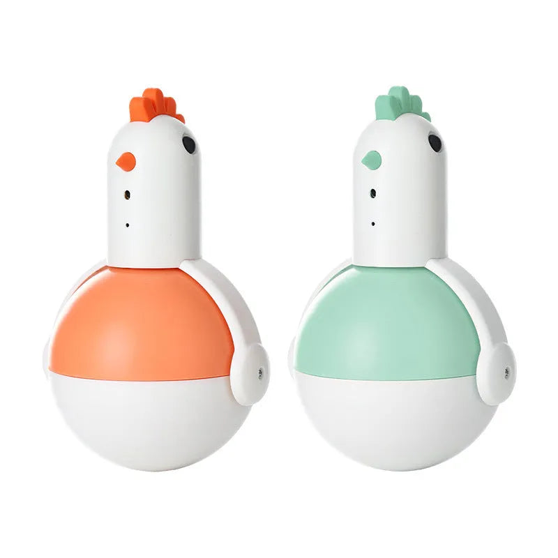 Green electric cat toy chicken with laser light feature on flat surface