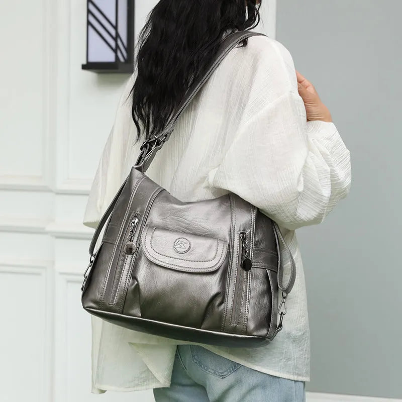 Women's PU leather shoulder messenger bag with zip compartments, available in black, brown or champagne