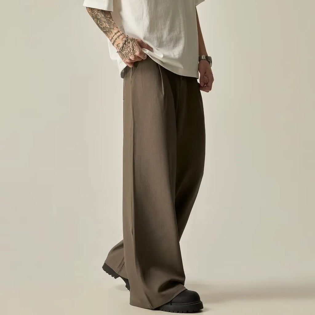 Men's solid black wide-leg casual trousers with a straight-leg cut and elasticised waist.