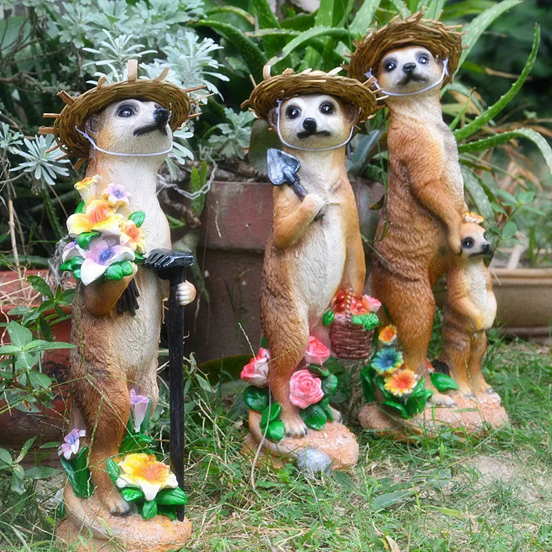 Three straw hat mongoose resin ornaments for garden decoration: mother and son, with rake, and with shovel.