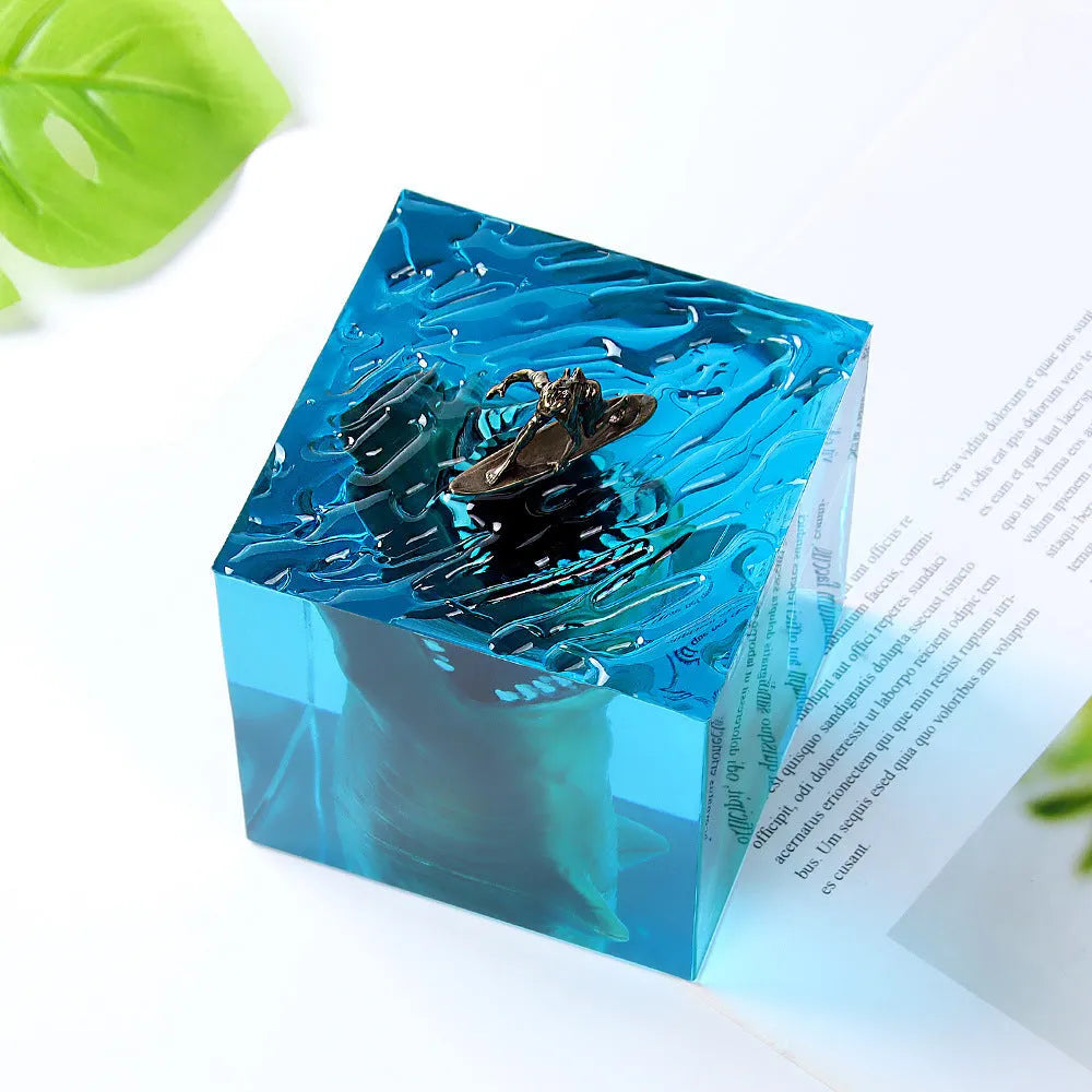 Clear epoxy resin shark surfer night light ornament with LED base in 5cm and 8cm sizes.