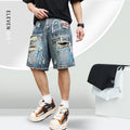 Blue denim shorts for men with rips and a graffiti pattern, featuring a zipper fly.