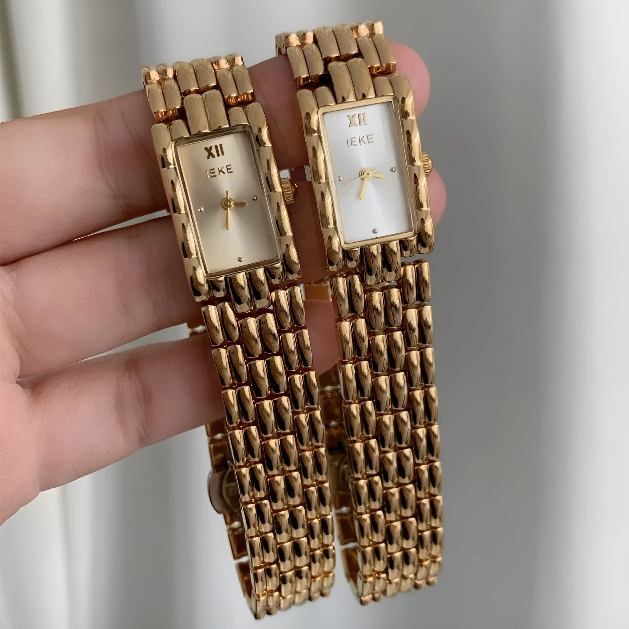 Women's mid-century bracelet watch with a 15mm dial, stainless steel case, and butterfly clasp in silver and gold colour options.