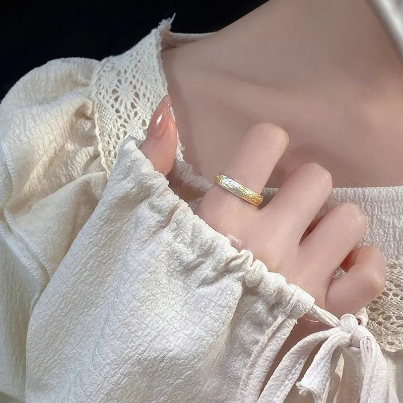 Open-mouth geometric white copper ring with Xiangyun pattern in silver-gold electroplate.