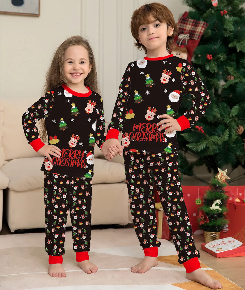 Family wearing matching red plaid Christmas pyjamas with dog in coordinating pyjamas