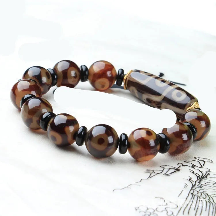 Distressed agate Tibet beads bracelet with three eye dzi design and polished stone beads