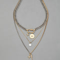 Eye pendant multi-layer twin necklace for women with alloy electroplated clavicle chain and geometric ellipse shapes.
