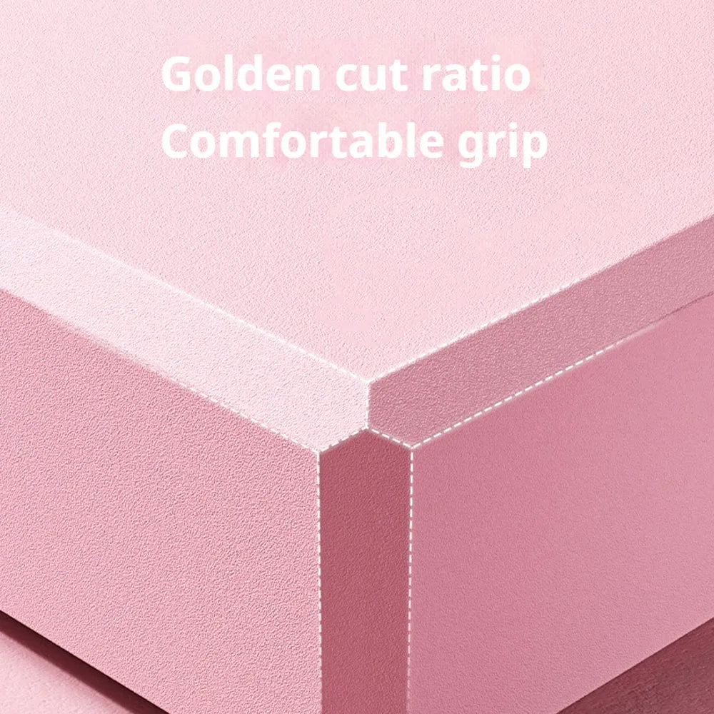 Solid colour EVA foam yoga block on a gym mat, showing its rectangular shape and ridged sides.