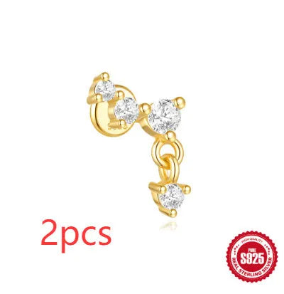 Geometric moon and star earrings in S925 sterling silver with embedded diamonds and a gold colour finish.