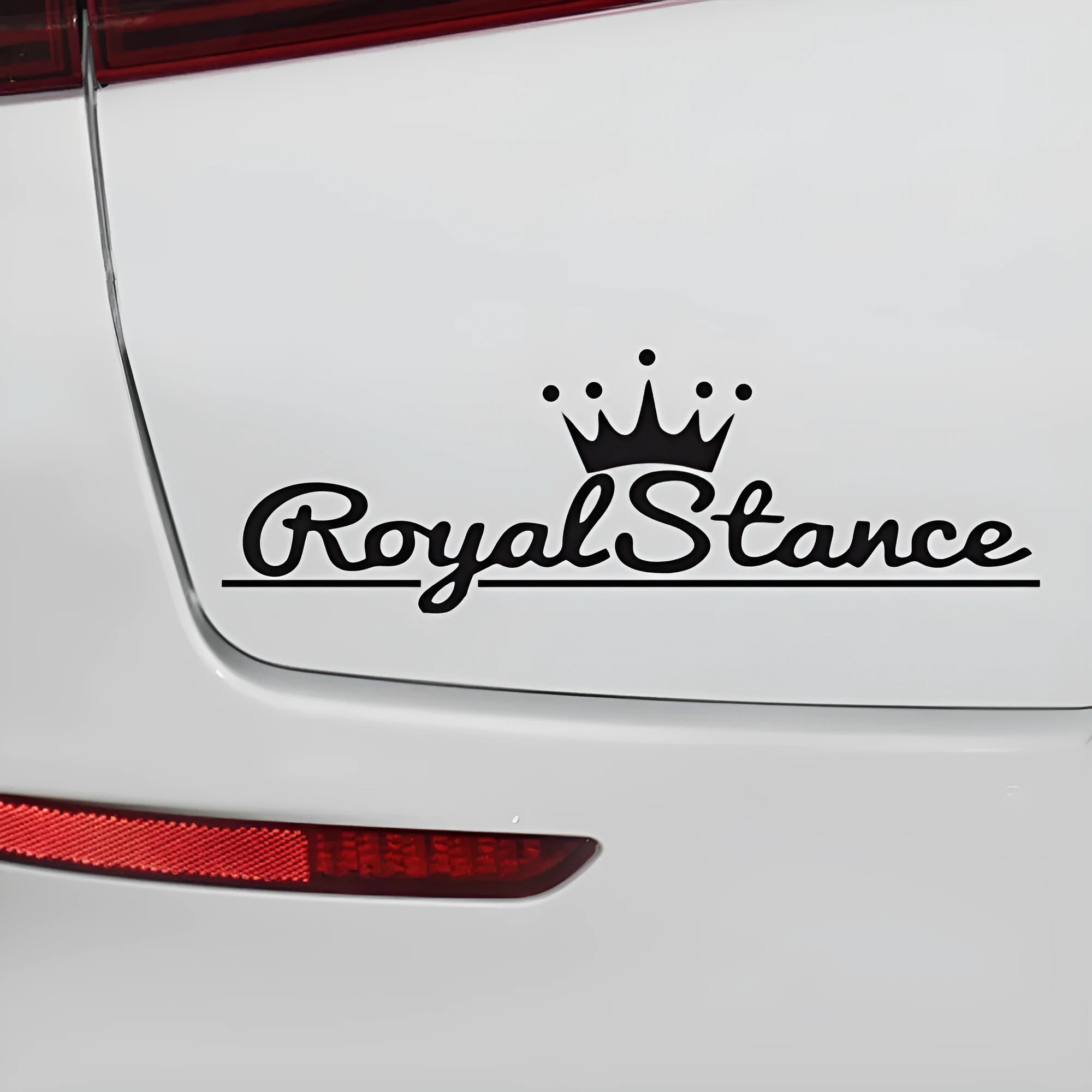 Large reflective crown-shaped car sticker on a vehicle window, showing black, white and colour options.