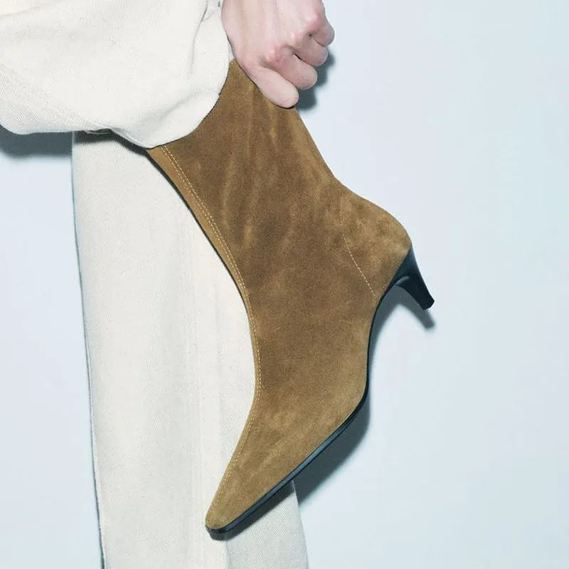Brown women's square toe ankle boots with a side zipper and a kitten heel on a waterproof platform sole.