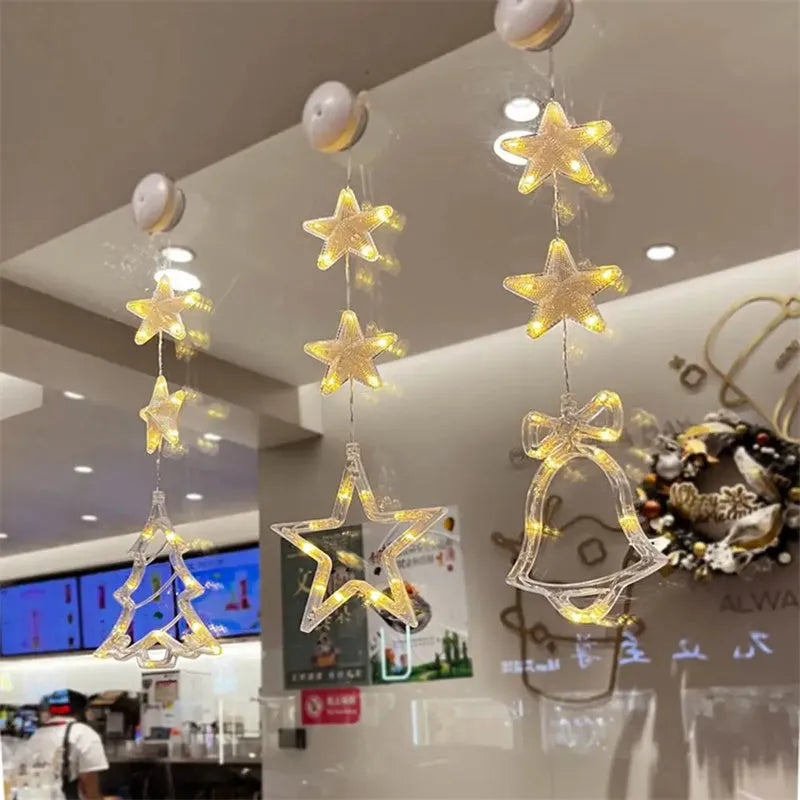 Set of three Christmas LED star window lights with suction cups on a glass window, warm glow, plastic housing, battery operated