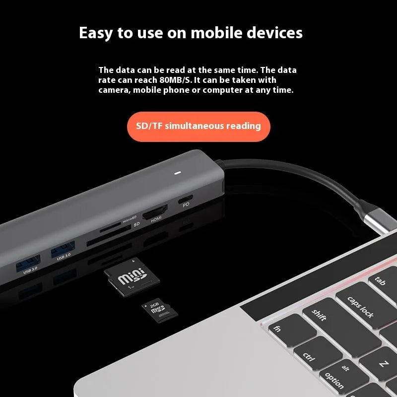 LQT-LH07 model 7-in-1 silver USB C hub showing USB-C plug, PD port, USB-A ports, and SD and microSD card slots.