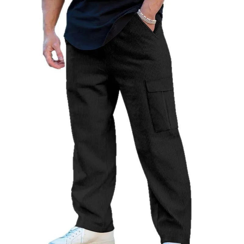 Men's navy blue corduroy cargo trousers with a drawstring waist and straight legs laid flat.