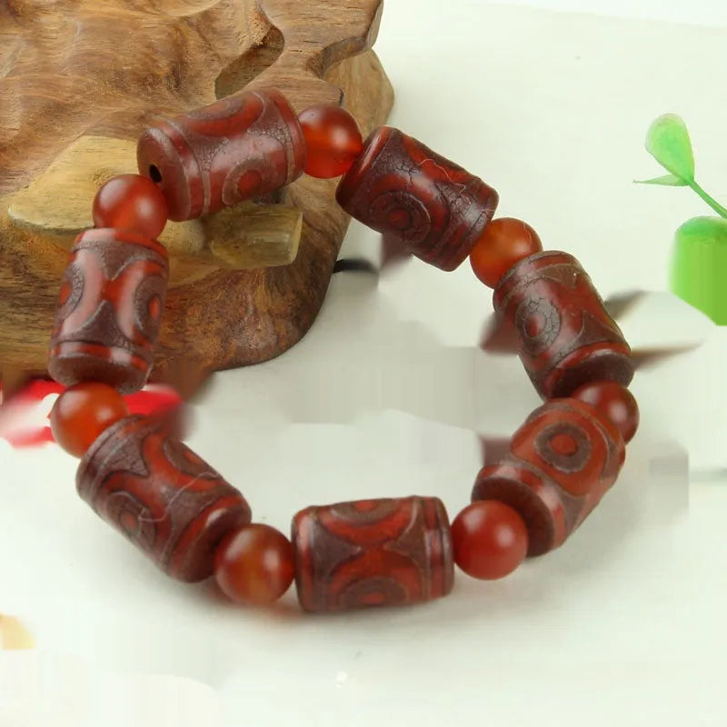 Distressed agate Tibet beads bracelet with three eye dzi design and polished stone beads