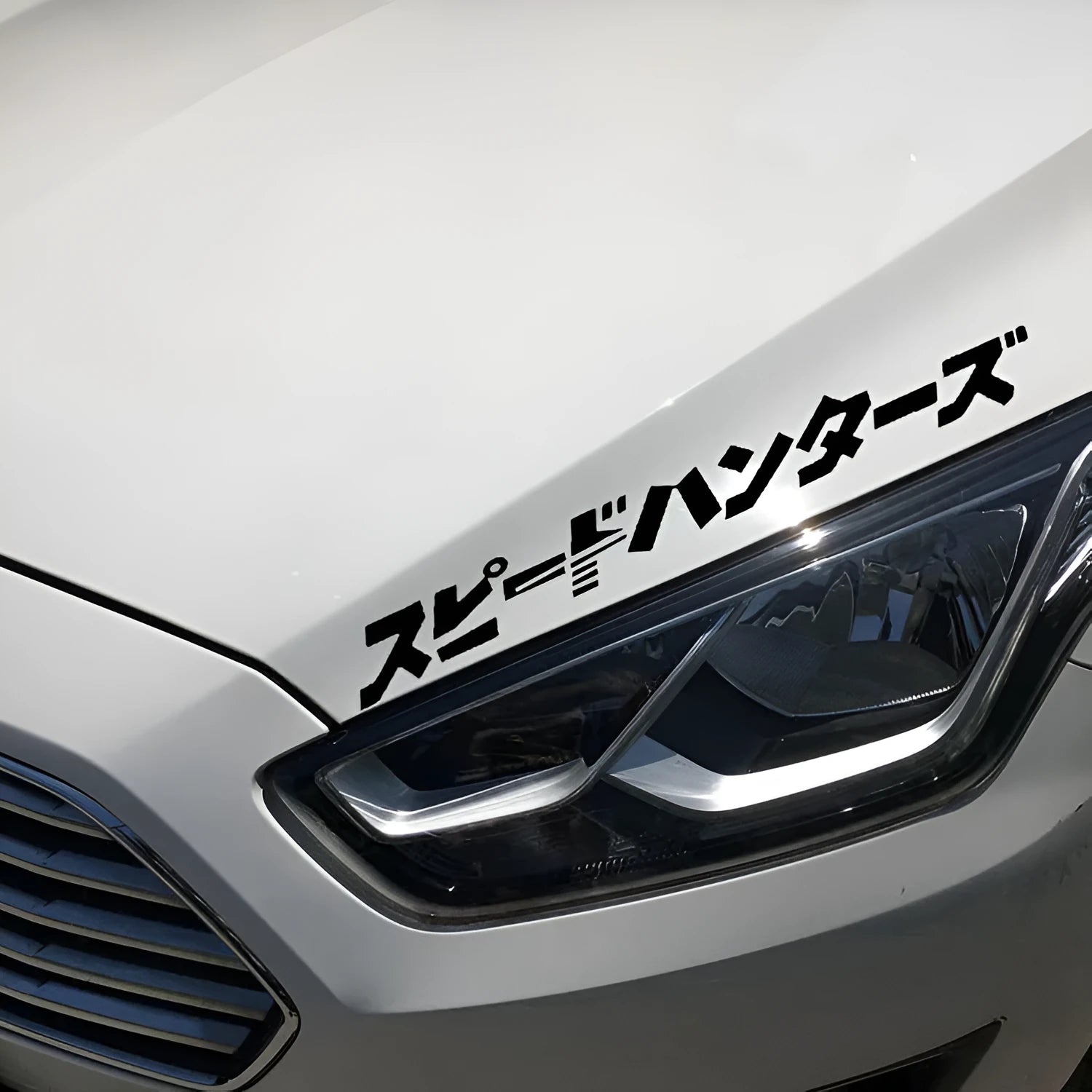 Black and white reflective Japanese-style car sticker measuring 35x35cm on a vehicle door.