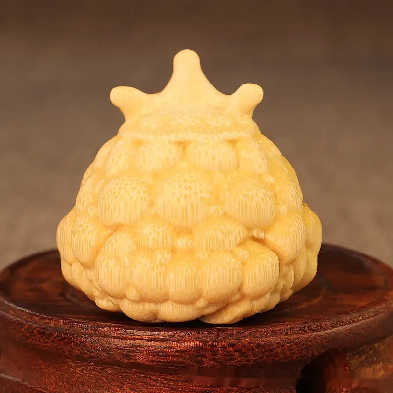 Solid bamboo carving of a cute Crown Princess Toad ornament with live eye detail.