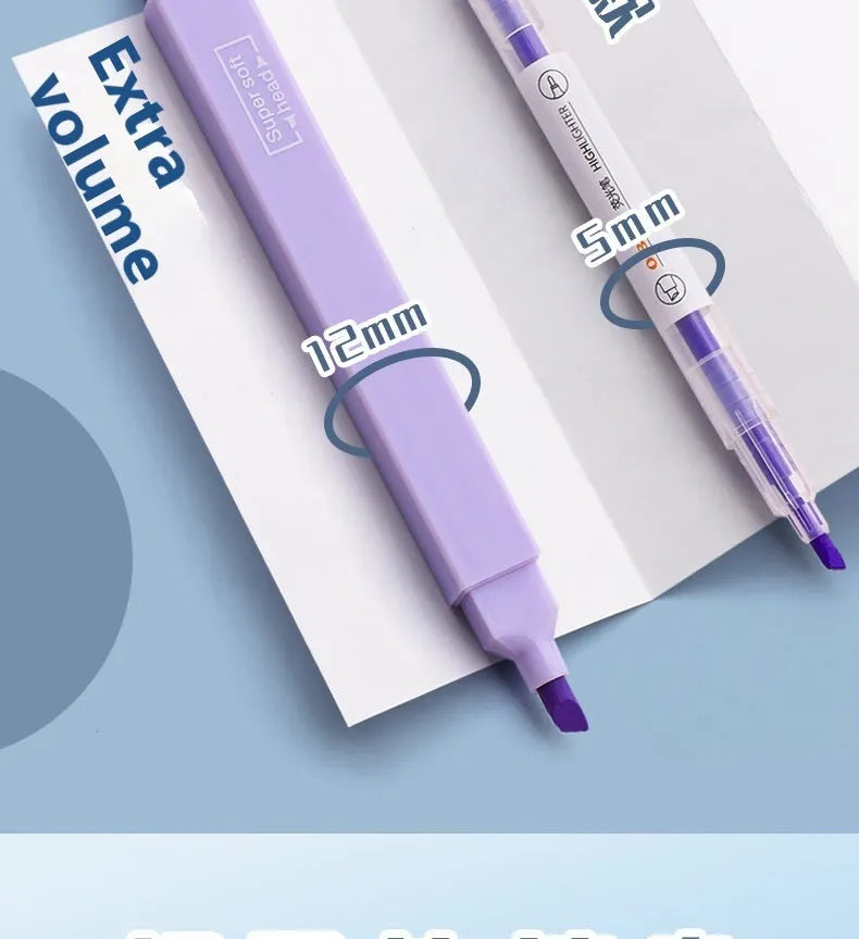 Set of double-tipped fluorescent marking pens in mixed colours on a white background.