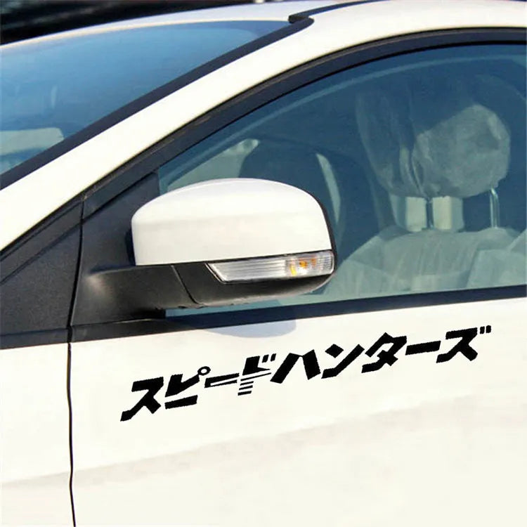 Black and white reflective Japanese-style car sticker measuring 35x35cm on a vehicle door.