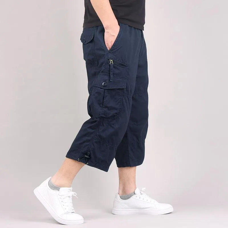 Man wearing loose khaki cotton cropped casual pants suitable for sports.