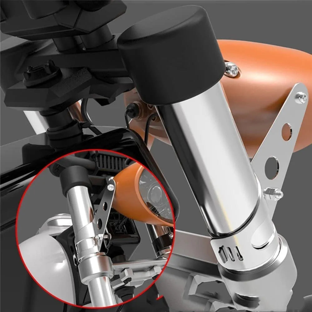 Pair of black iron motorcycle headlamp support brackets shown from the side