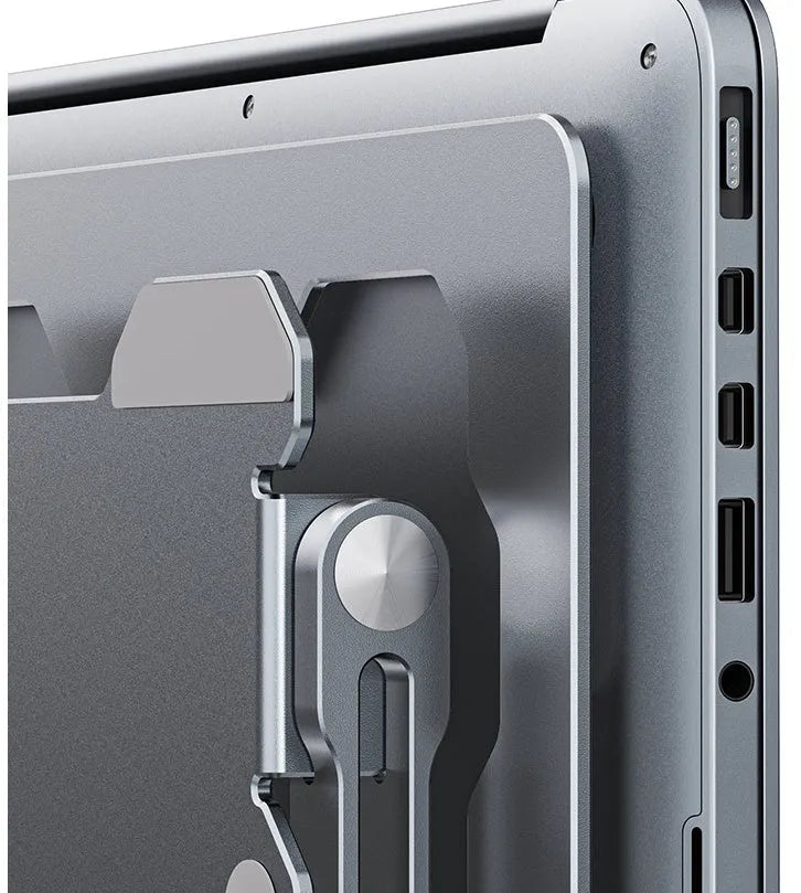 Grey adjustable aluminium laptop stand in folded and open positions on a desk.