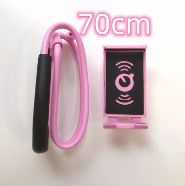 White plastic and foam 360-degree rotatable universal phone holder on a table.
