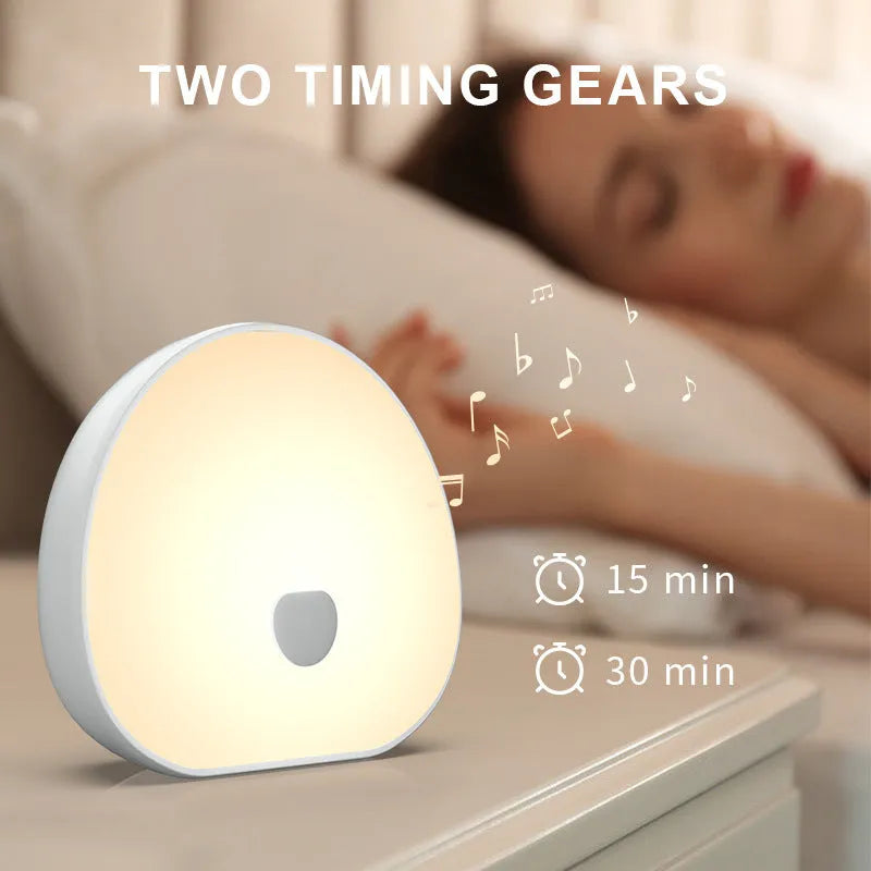 White silicone baby feeding comforter with rechargeable battery and music function