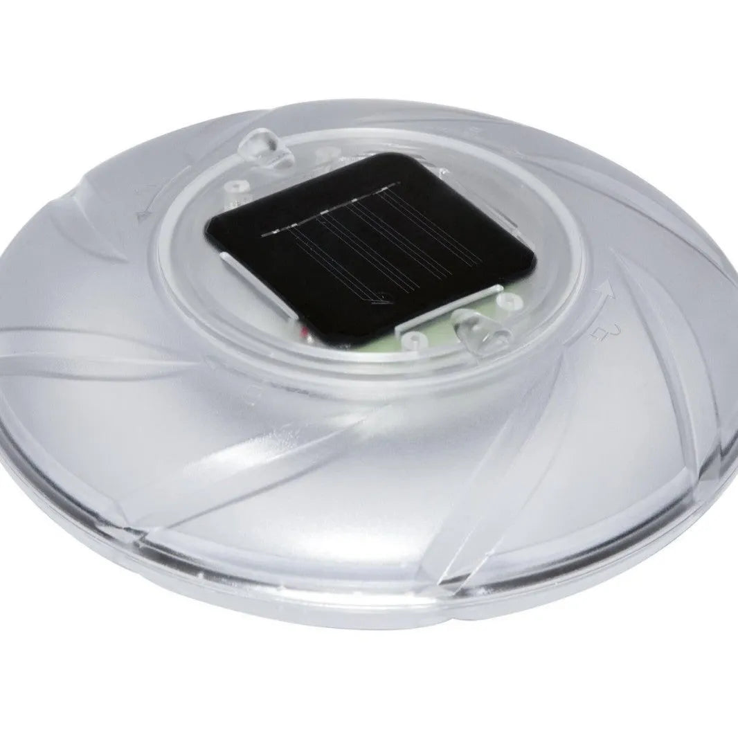 Bestway 58111 solar floating light floating on water surface in outdoor pool at dusk