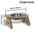 Wooden cat feeder with two stainless steel bowls for food and water on an anti-tip base.
