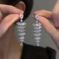 Women's silver pagoda colour Christmas tree drop earrings with pagoda shape on copper studs.