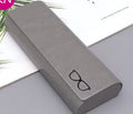 Leather glasses case in black, blue, grey, orange, white, and pink with single compartment for one pair of glasses