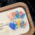 Three-dimensional carved jellyfish plastic wearable armour set in almond nail colour with marine theme