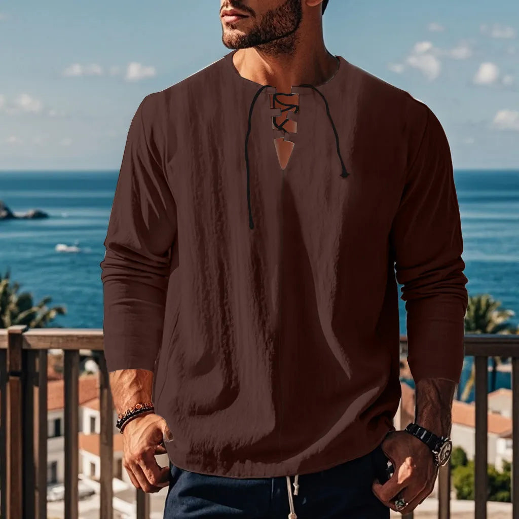 Cotton linen blend solid colour beach shirt in a loose pullover style on a hanger.