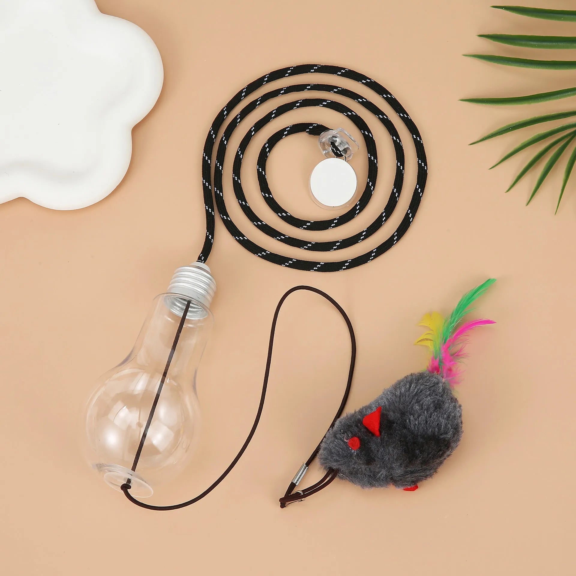 Interactive cat toy hanging from door frame with dangling mouse toy and elastic rope extending downward