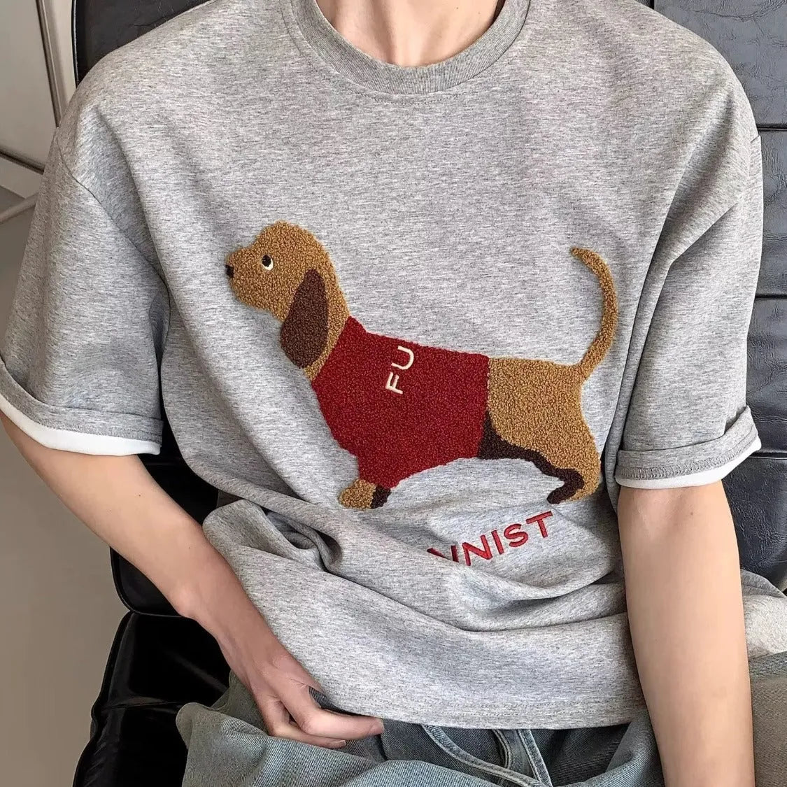Grey men's cotton T-shirt with an embroidered sausage dog design on the front.