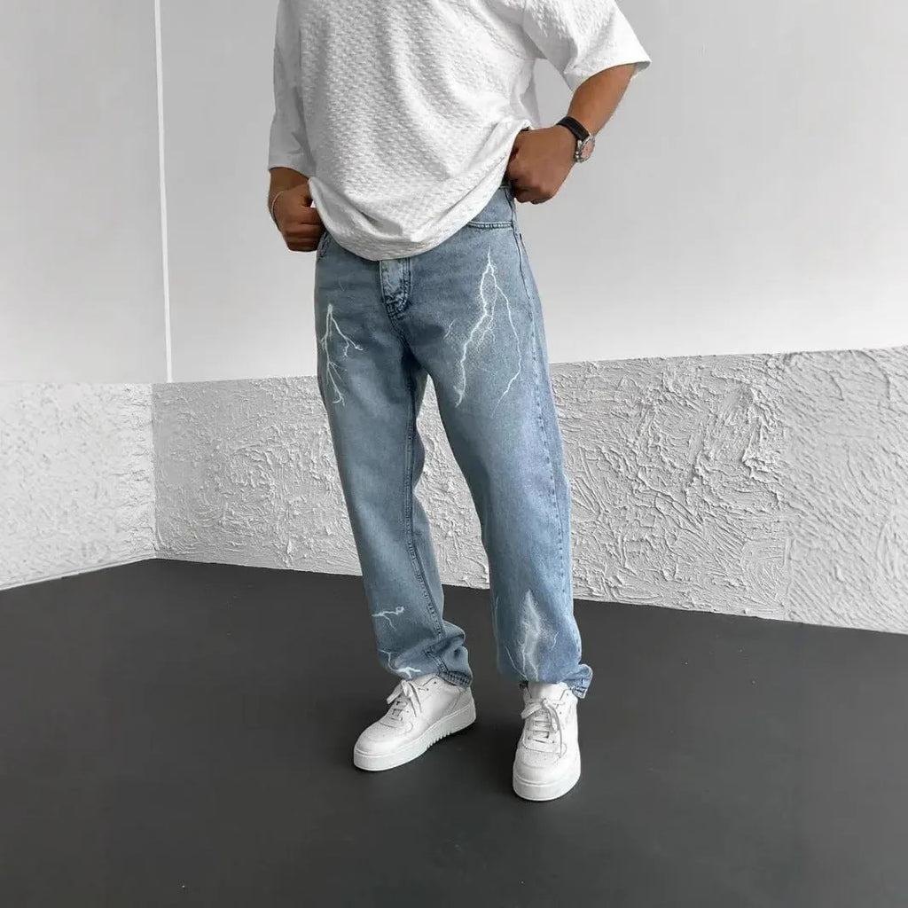 Men's blue straight-leg denim jeans with mid waist and zipper fly on solid background